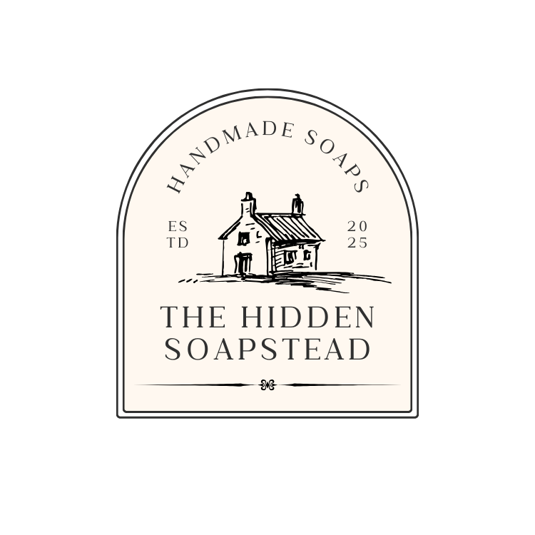 Business logo of The Hidden Soapstead.  Arched label with the text "Handmade Soaps" above a sketch of a house. Reads "The Hidden Soapstead," established 2025. Minimalist, rustic design.
